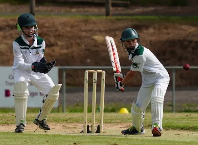 An Under 13 batter at the crease